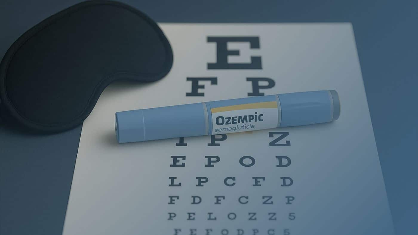 Caneta de Ozempic (semaglutida) sobre uma tabela de teste de visão, representando possíveis efeitos oculares do medicamento.